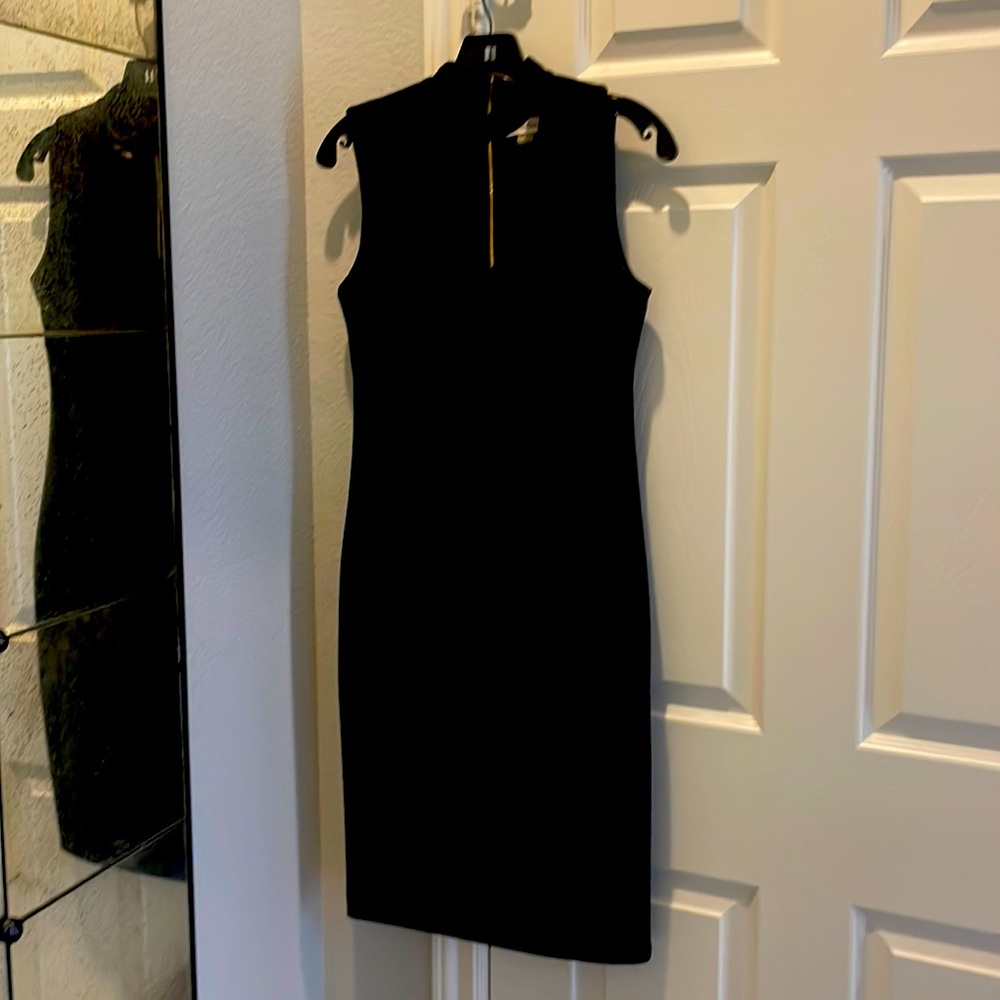 Calvin Klein size 4 black cocktail dress with gold zipper worn one time EUC
